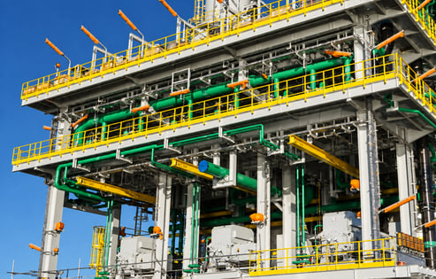 Industrial plant beneath blue skies